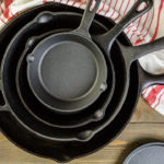 How To Clean A Cast Iron Skillet Congratulations Kitchen And Bath family! You've made it this far! Are you ready to learn how to clean a cast iron skillet the right way so that you can reduce the number of times that you will have to season your cast iron? Grab your skillet and let us dive right in! You are going to need: Salt Oil Fresh Water After you have the items above we can now get started so follow along with these steps below: Sprinkle a spoonful of salt onto the dirty cast iron skillet Take a spoonful of cooking oil and pour it over the salt Rub the oil-salt paste over the pan or skillet in circular motions to help loosen debris Use a metal spatula to scrape off any food that is really caked on Now, wipe the salt and the oil out of the skillet or pan The cooking oil is added to help loosen crud & it also adds more seasoning to the skillet or pan. We know that you may want to add some dish soap to kill off the germs but DON'T DO IT! The salt is a great antibacterial alternative. All you need when cleaning your cast iron skillet or pan is salt and oil! Continuing to clean the skillet by using salt to clear away debris and then rubbing it down with oil, your cast iron will only get better with time!